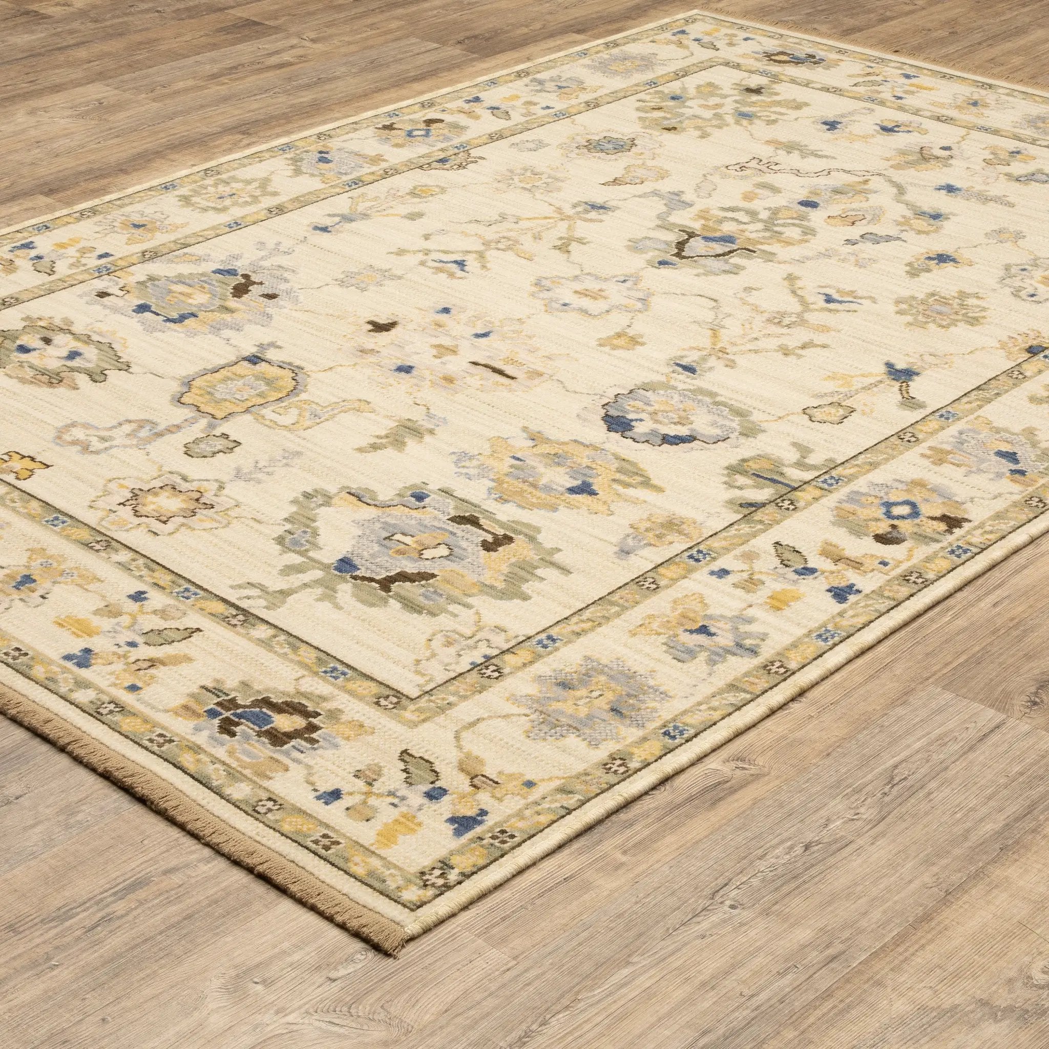 Acacia ACA13 Beige/Tan neutral traditional area rug with warm beige and tan tones, vintage-style pattern, wool nylon blend, and fringe.