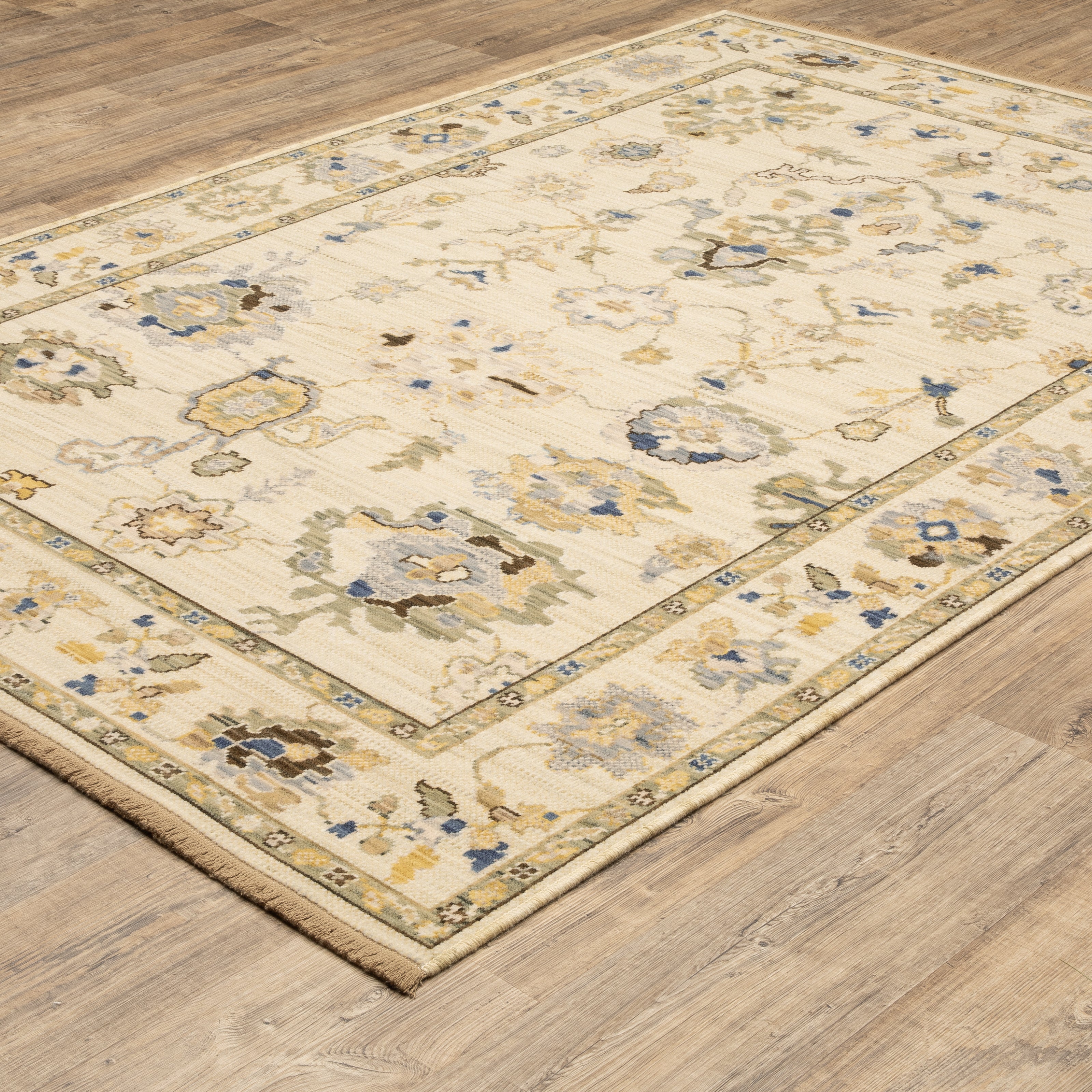 Acacia ACA13 Beige/Tan neutral traditional area rug with warm beige and tan tones, vintage-style pattern, wool nylon blend, and fringe.