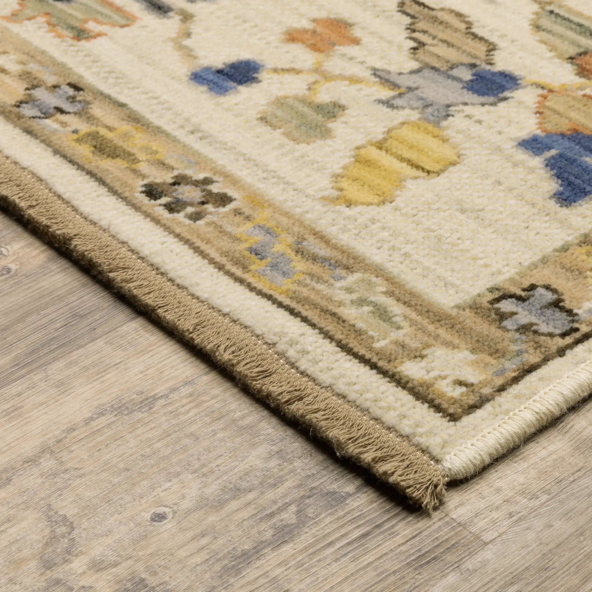 Acacia ACA13 Beige/Tan neutral traditional area rug with warm beige and tan tones, vintage-style pattern, wool nylon blend, and fringe.