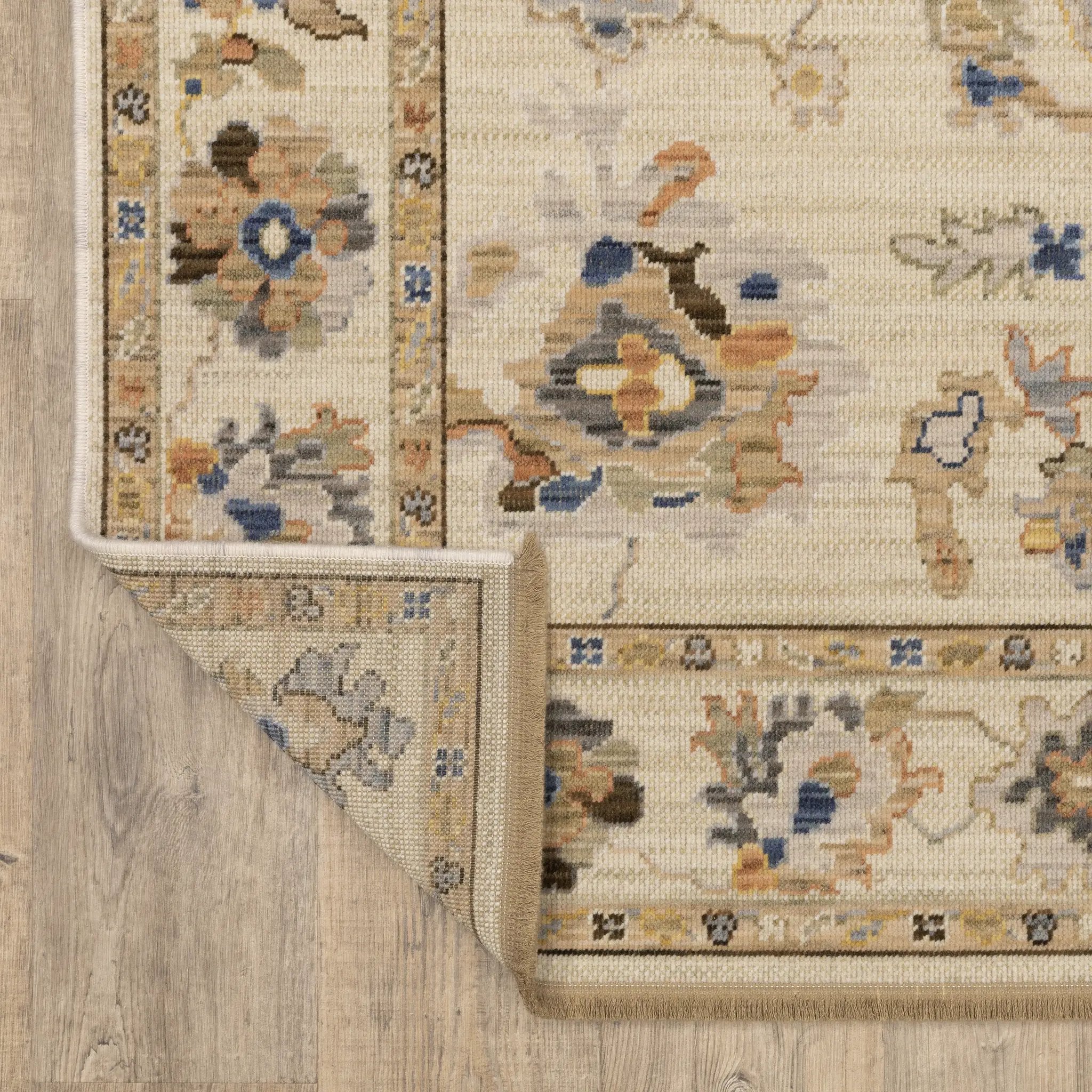 Acacia ACA13 Beige/Tan neutral traditional area rug with warm beige and tan tones, vintage-style pattern, wool nylon blend, and fringe.