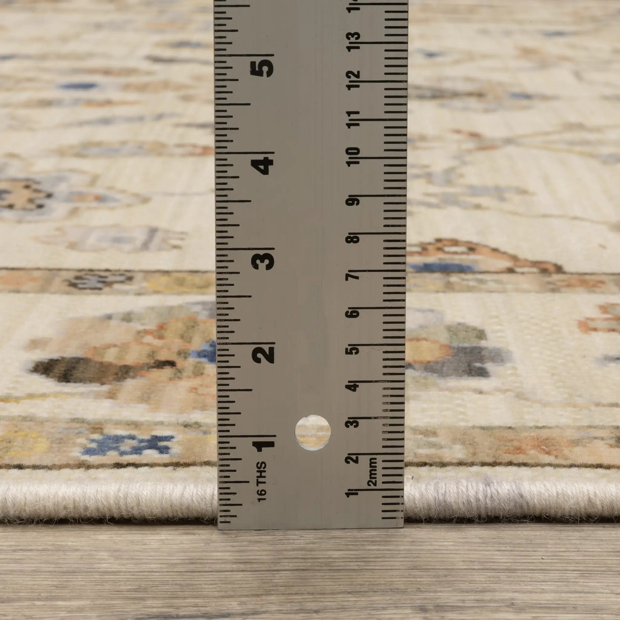 Acacia ACA13 Beige/Tan neutral traditional area rug with warm beige and tan tones, vintage-style pattern, wool nylon blend, and fringe.