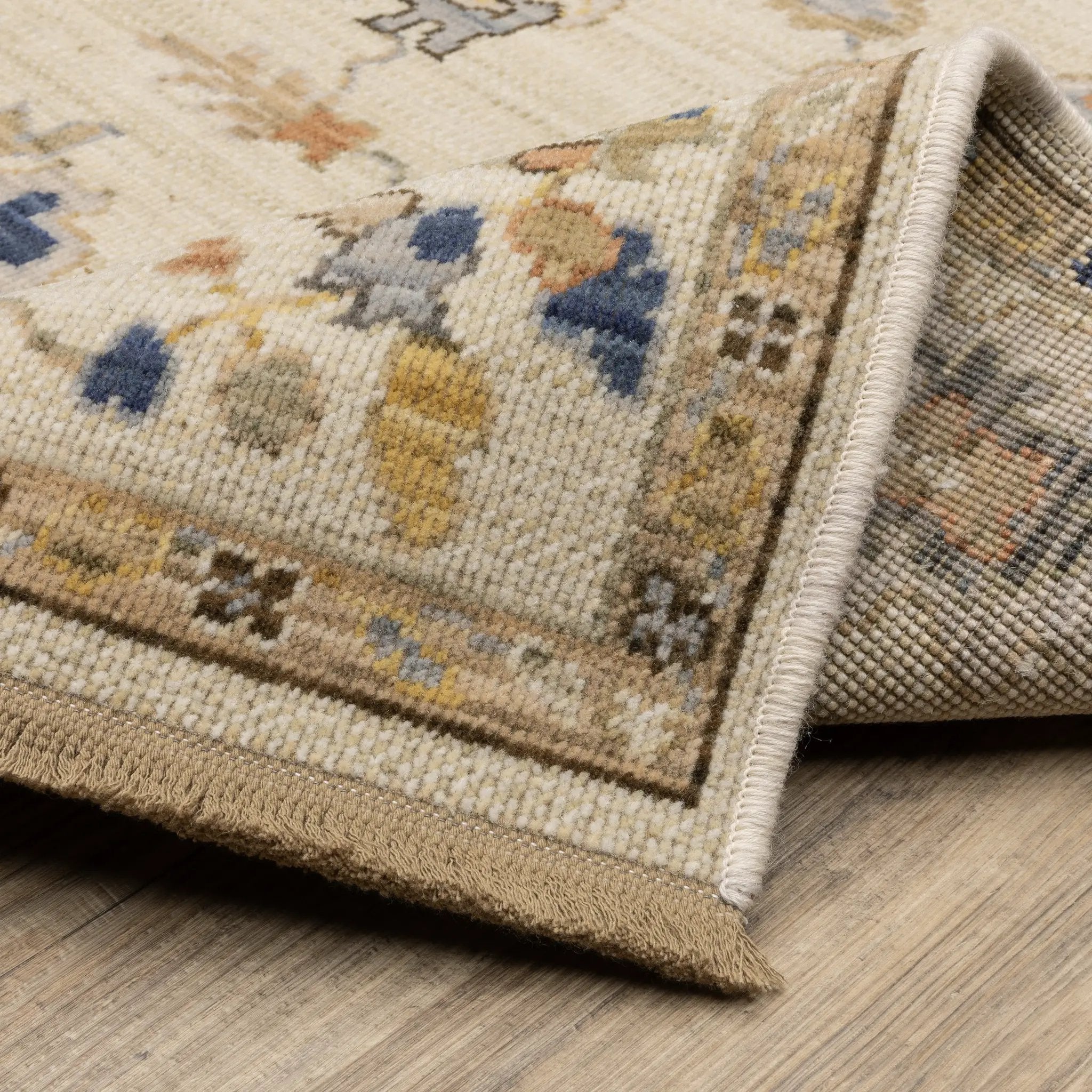 Acacia ACA13 Beige/Tan neutral traditional area rug with warm beige and tan tones, vintage-style pattern, wool nylon blend, and fringe.