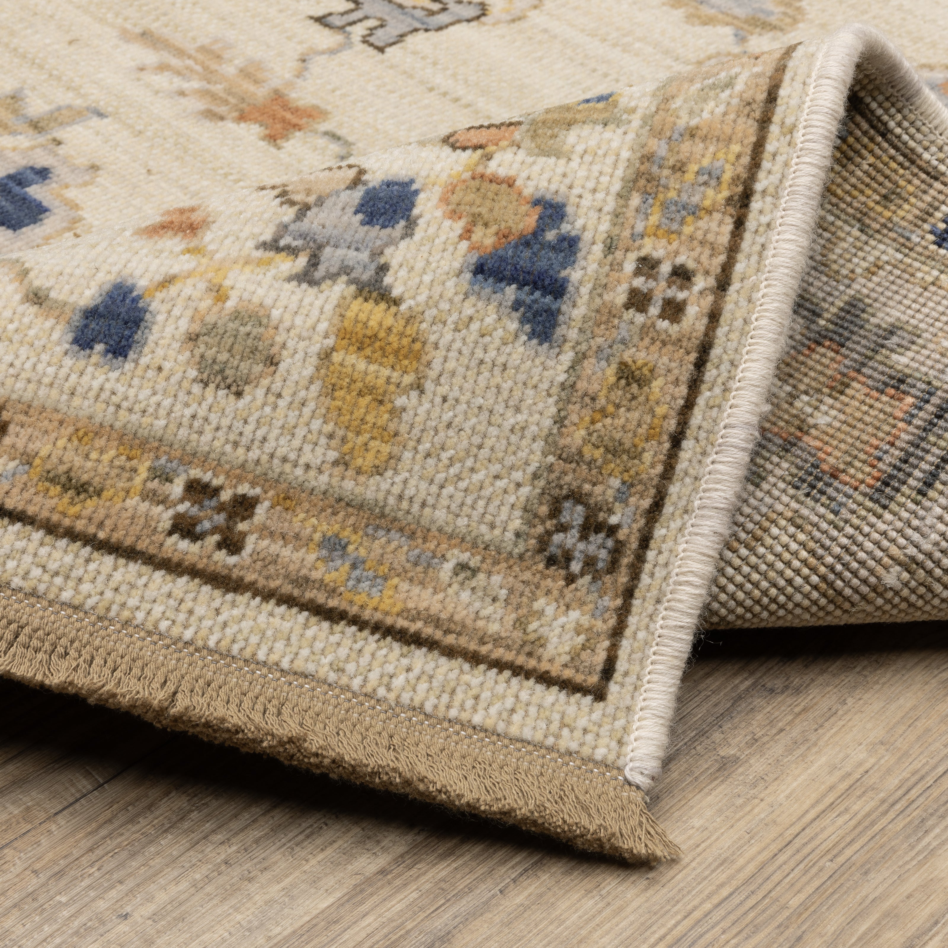 Acacia ACA13 Beige/Tan neutral traditional area rug with warm beige and tan tones, vintage-style pattern, wool nylon blend, and fringe.
