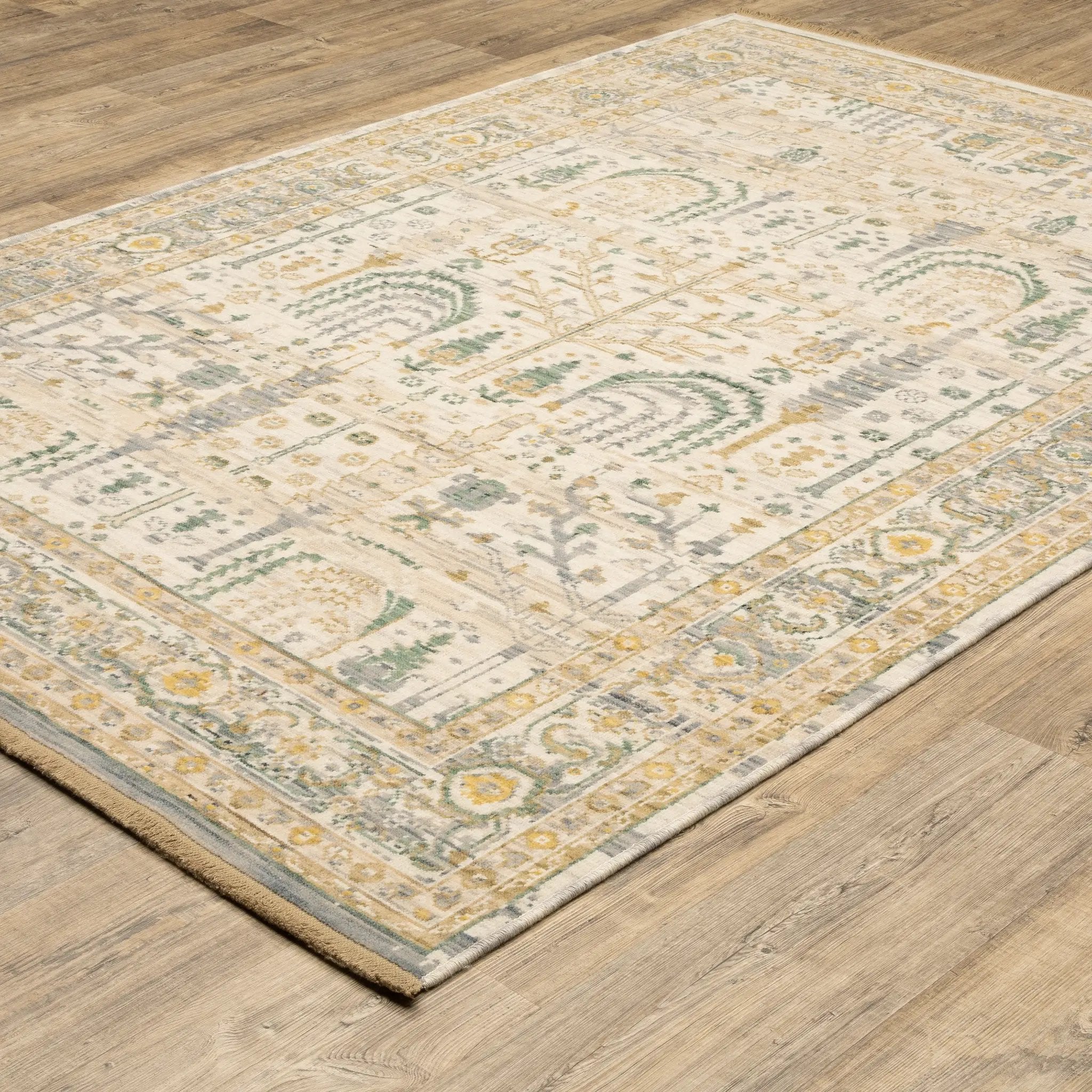 Acacia ACA14 Beige/Green nature-inspired traditional area rug with soft beige and green palette, warm accent colors, and cotton fringe.