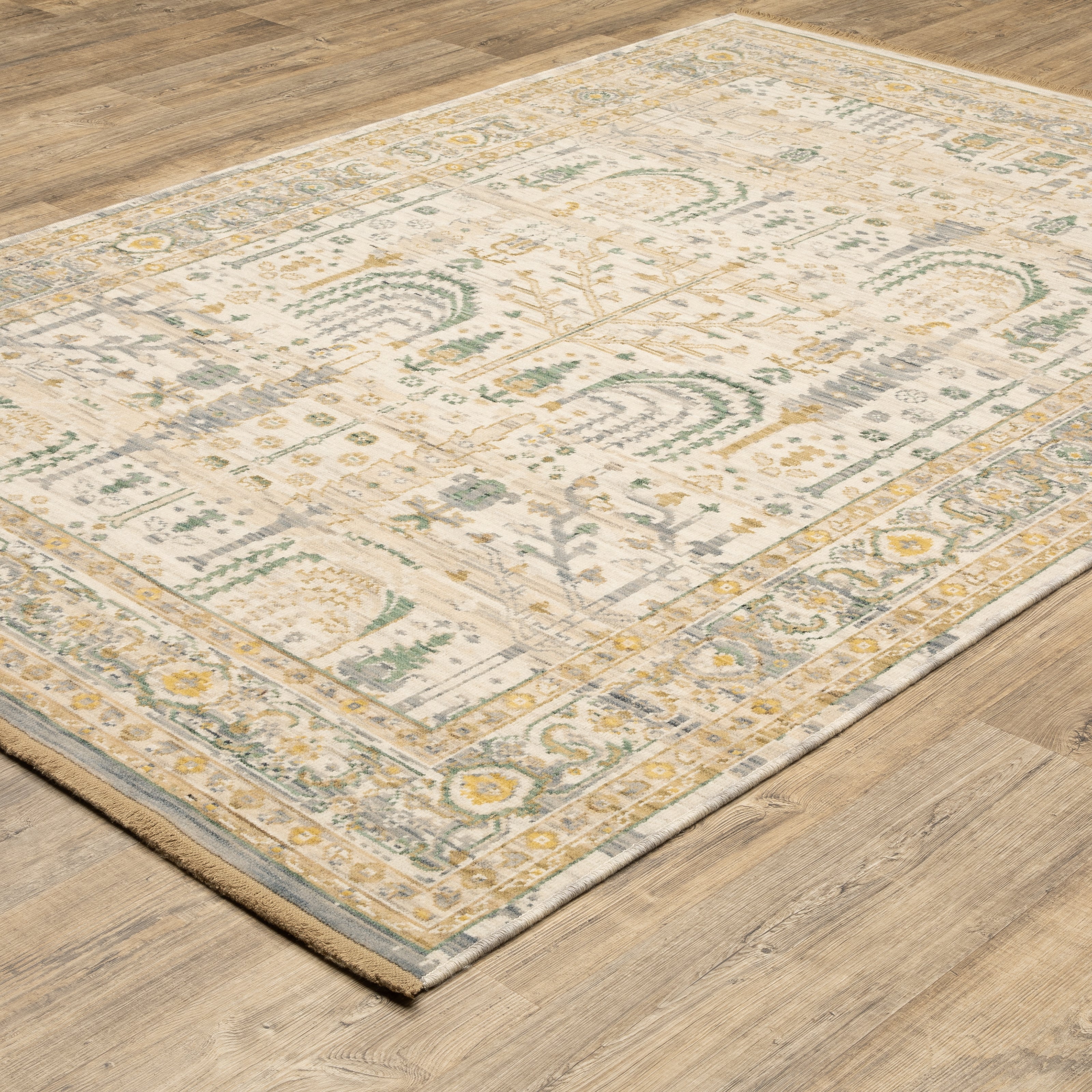 Acacia ACA14 Beige/Green nature-inspired traditional area rug with soft beige and green palette, warm accent colors, and cotton fringe.