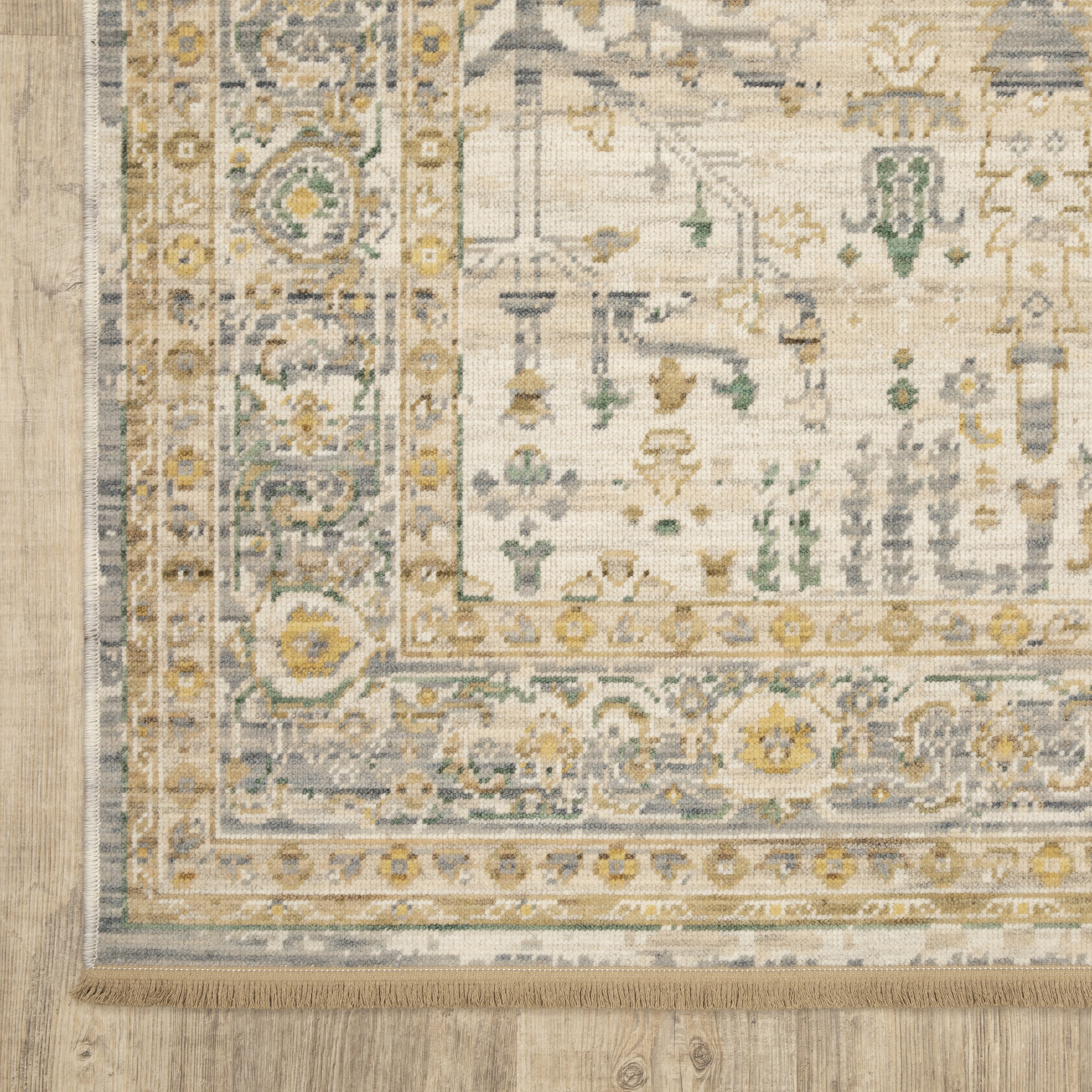 Acacia ACA14 Beige/Green nature-inspired traditional area rug with soft beige and green palette, warm accent colors, and cotton fringe.