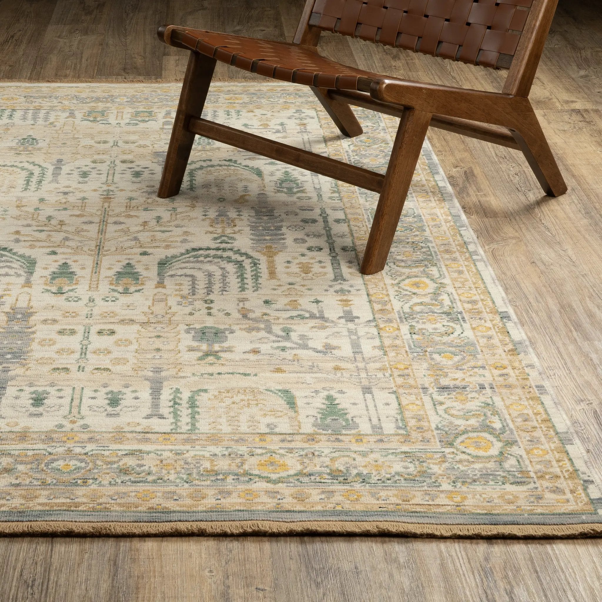 Acacia ACA14 Beige/Green nature-inspired traditional area rug with soft beige and green palette, warm accent colors, and cotton fringe.