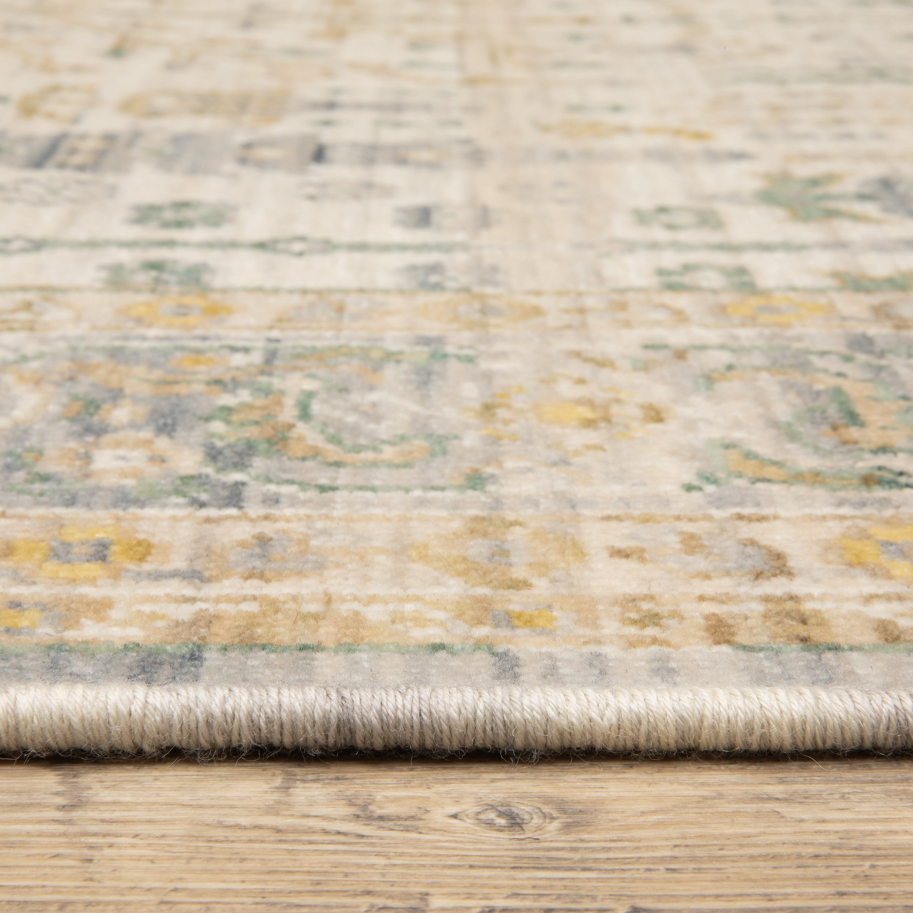 Acacia ACA14 Beige/Green nature-inspired traditional area rug with soft beige and green palette, warm accent colors, and cotton fringe.