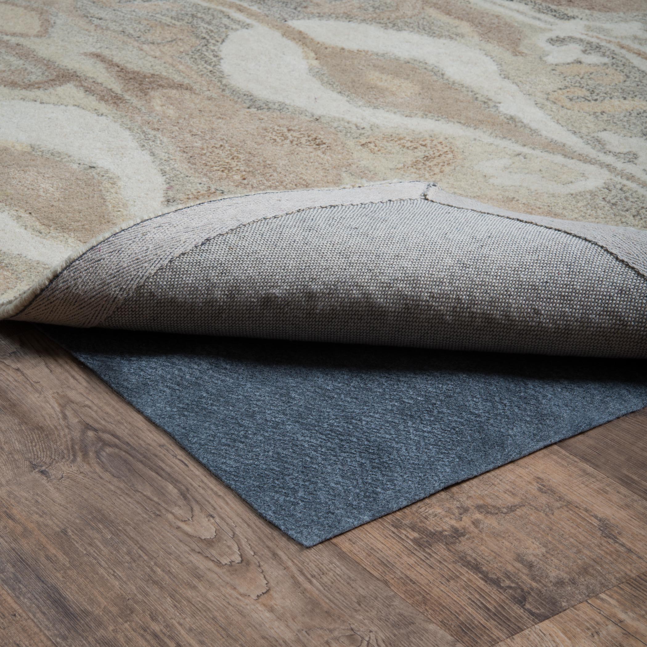 All Purpose Reversible 0004E Grey Rug Pad, grey reversible rug pad with low-profile needle punch construction for hard floors or carpet.