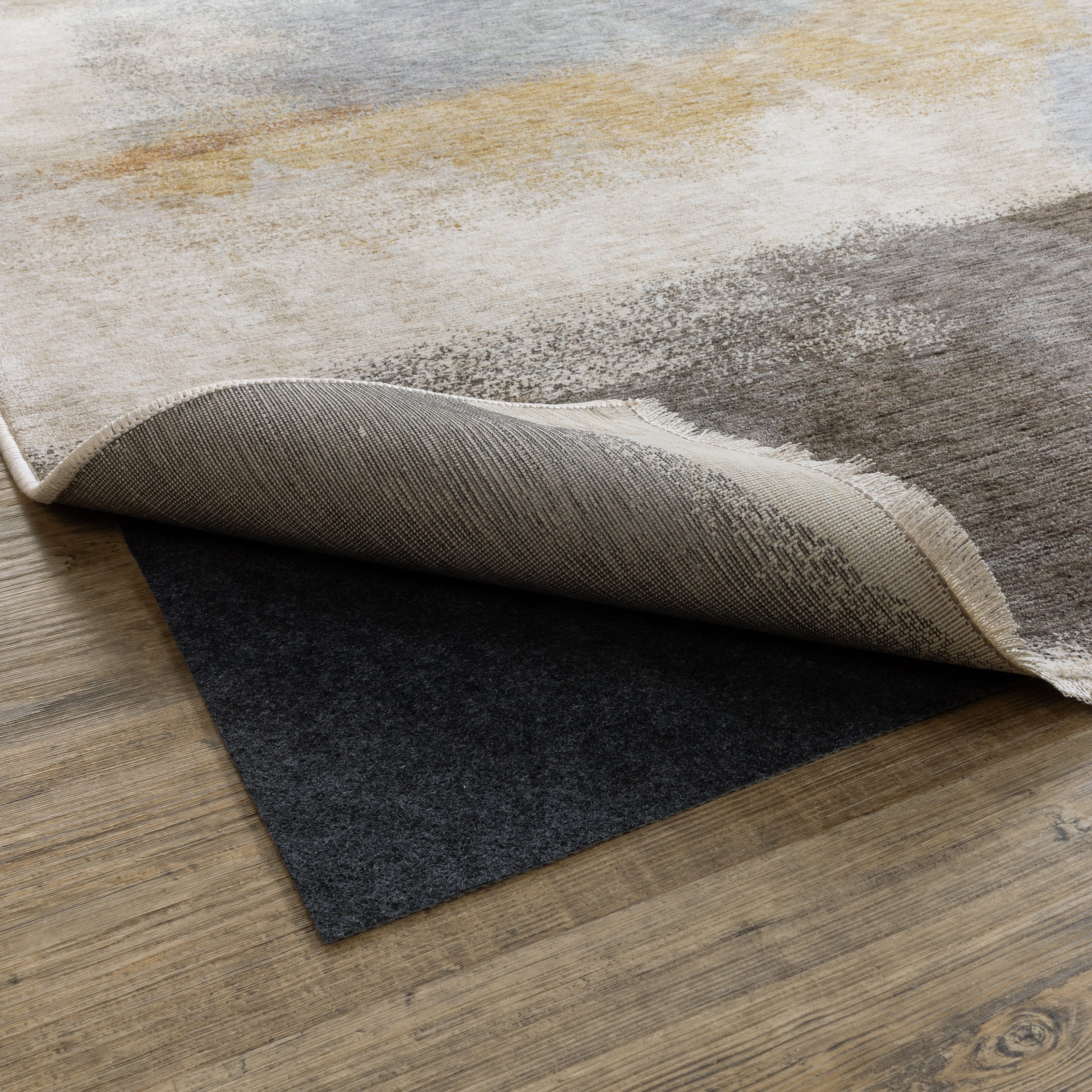 All Purpose Reversible 0004E Grey Rug Pad, grey reversible rug pad with low-profile needle punch construction for hard floors or carpet.