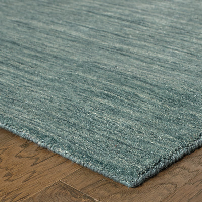 Aniston 27101 Light Blue Area Rug, light blue solid wool area rug with subtle heathered texture and soft handwoven surface.