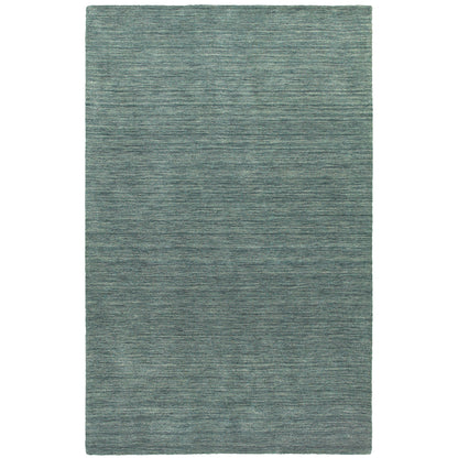 Aniston 27101 Light Blue Area Rug, light blue solid wool area rug with subtle heathered texture and soft handwoven surface.