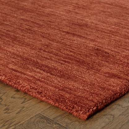 Aniston 27103 Rust Area Rug, rust solid wool area rug with heathered texture and warm handwoven surface.