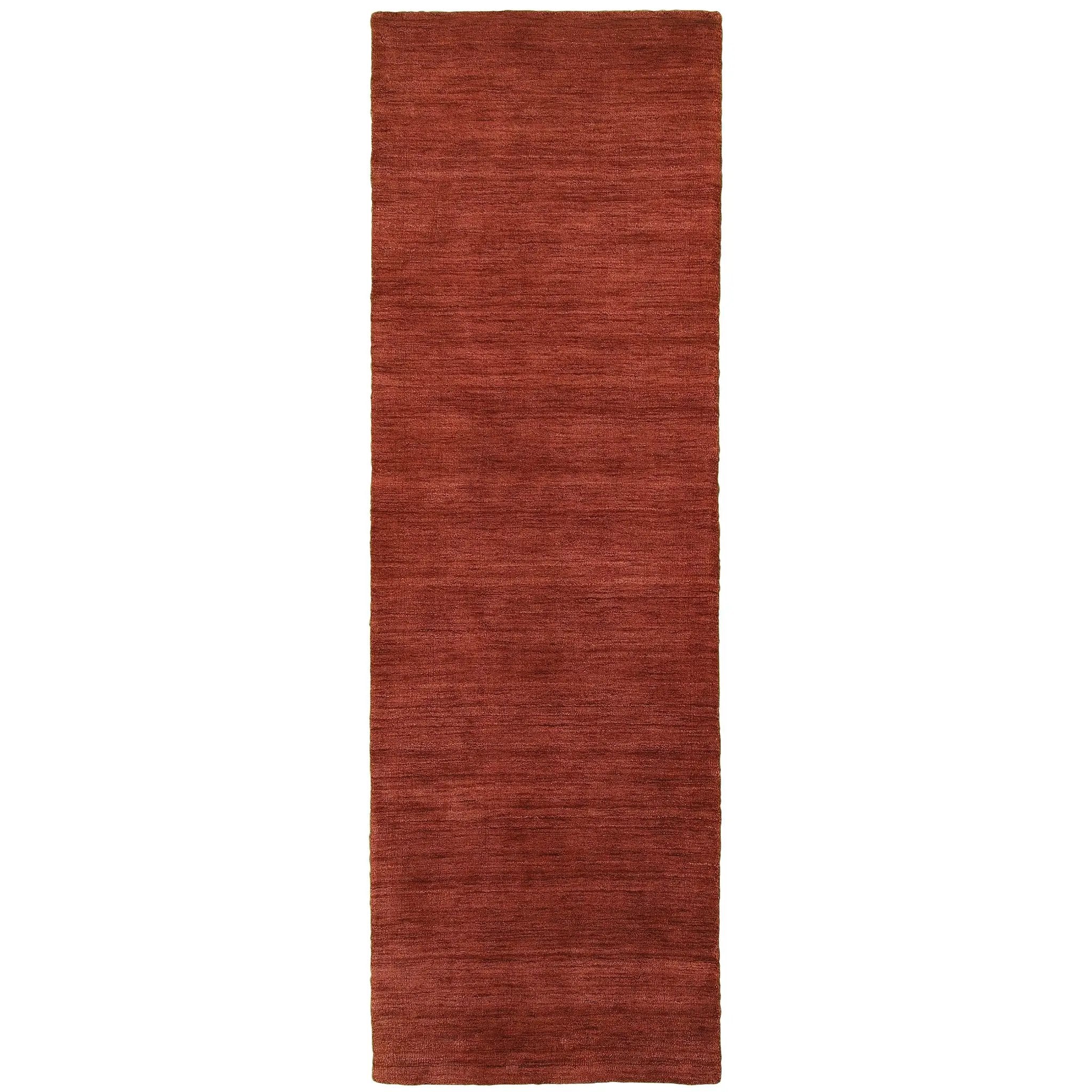 Aniston 27103 Rust Area Rug, rust solid wool area rug with heathered texture and warm handwoven surface.