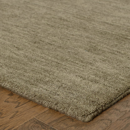 Aniston 27105 Oatmeal Area Rug, oatmeal solid wool area rug with heathered texture and warm handwoven surface.
