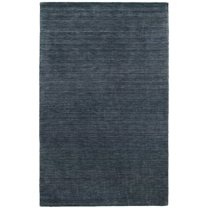 Aniston 27106 Navy Area Rug, navy solid wool area rug with heathered tonal variation and handwoven texture.