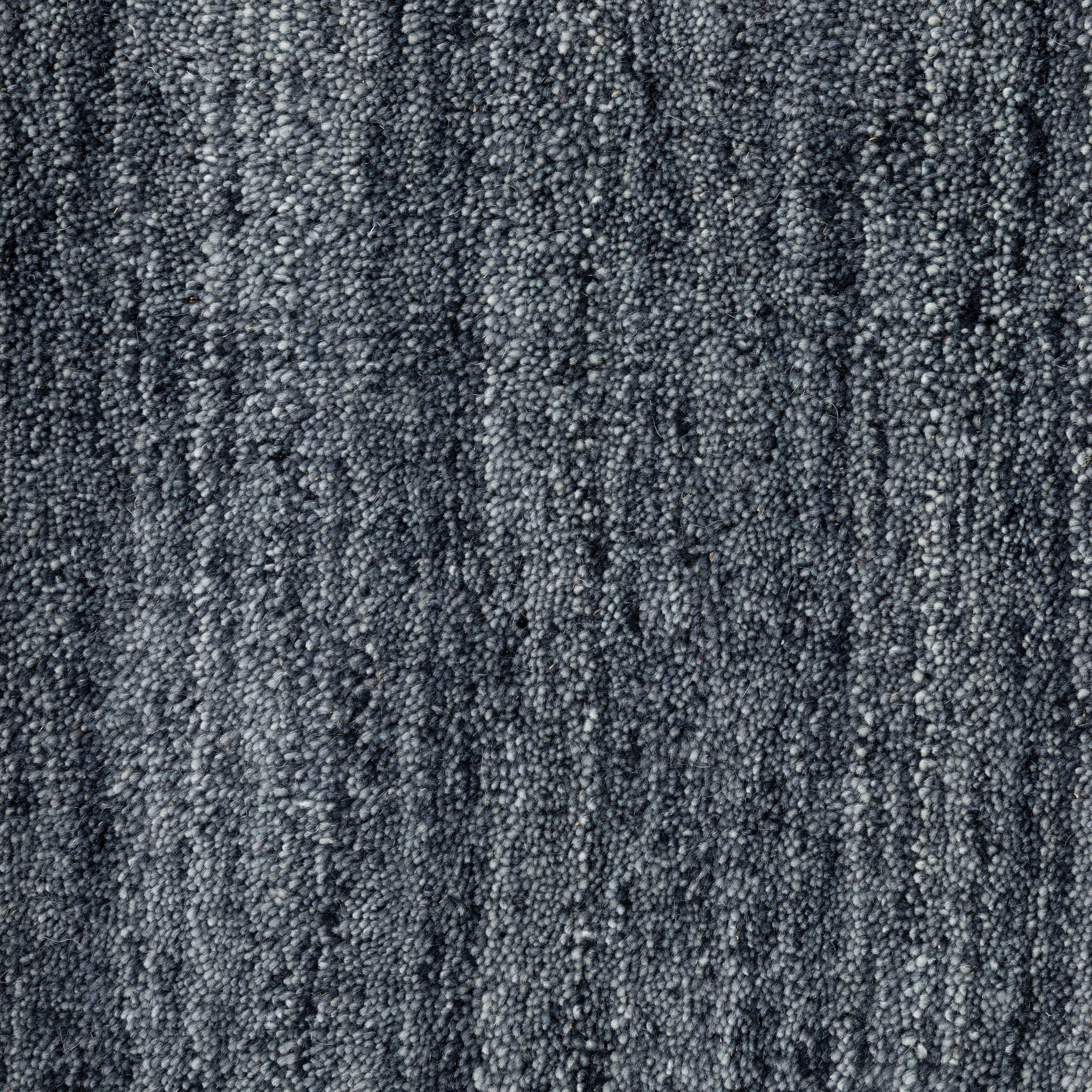 Aniston 27106 Navy Area Rug, navy solid wool area rug with heathered tonal variation and handwoven texture.