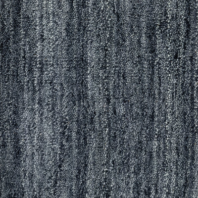 Aniston 27106 Navy Area Rug, navy solid wool area rug with heathered tonal variation and handwoven texture.