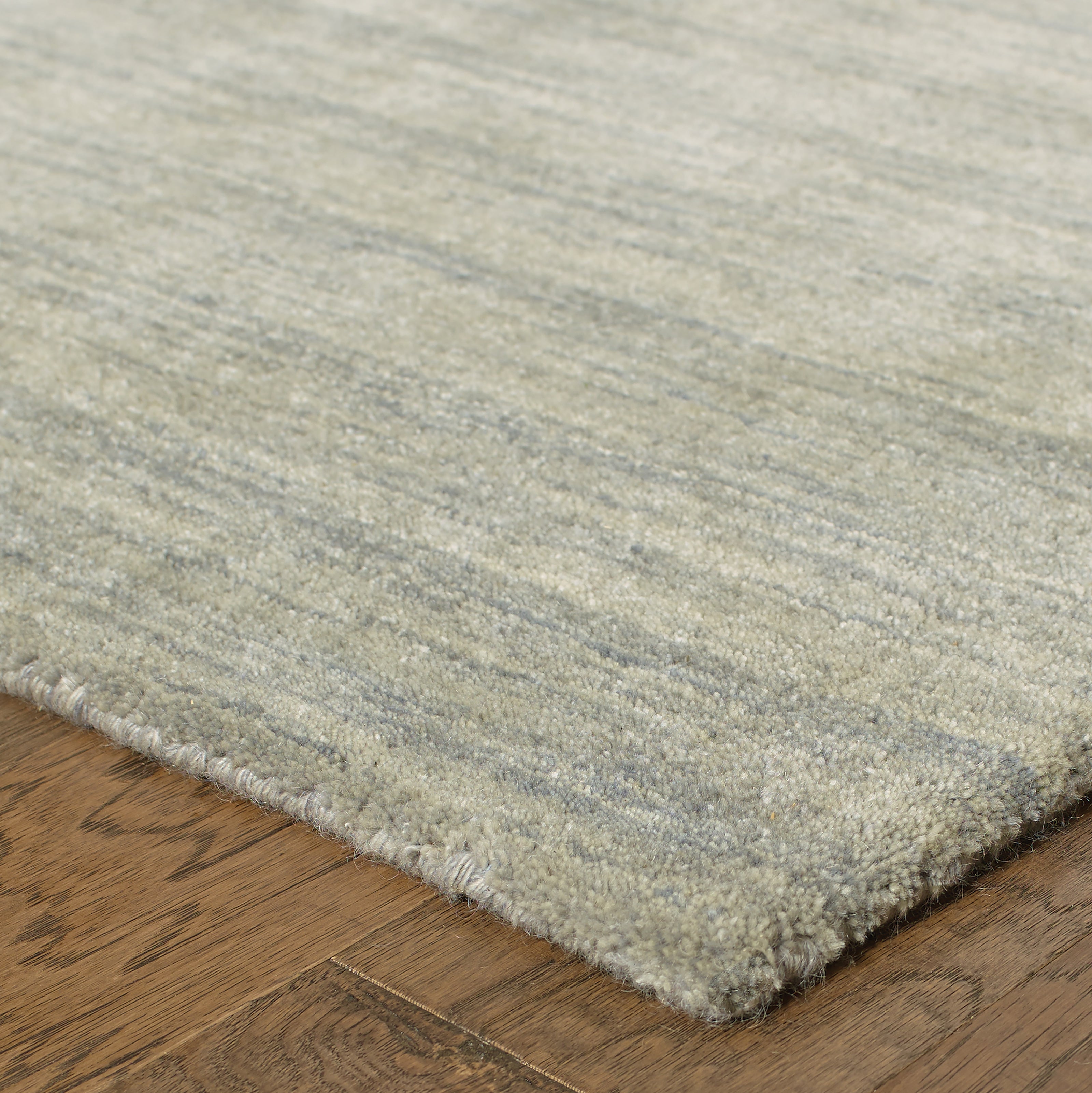 Aniston 27108 Grey Area Rug, grey solid wool area rug with heathered tonal texture and handwoven surface.