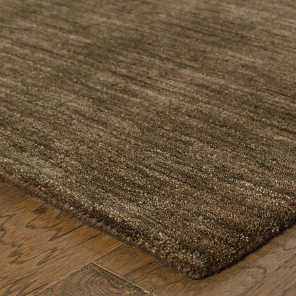 Aniston 27109 Brown Area Rug, brown solid wool area rug with heathered texture and natural handwoven surface.
