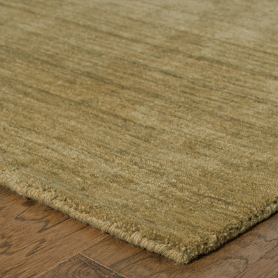 Aniston 27110 Gold Area Rug, gold solid wool area rug with heathered tonal depth and handwoven texture.