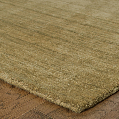 Aniston 27110 Gold Area Rug, gold solid wool area rug with heathered tonal depth and handwoven texture.