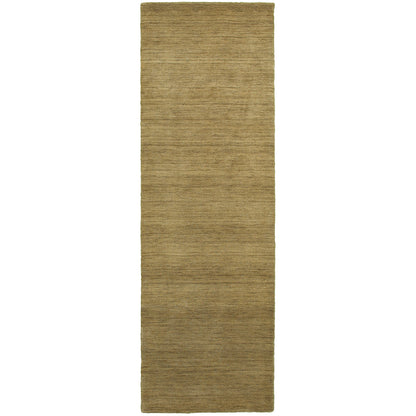 Aniston 27110 Gold Area Rug, gold solid wool area rug with heathered tonal depth and handwoven texture.
