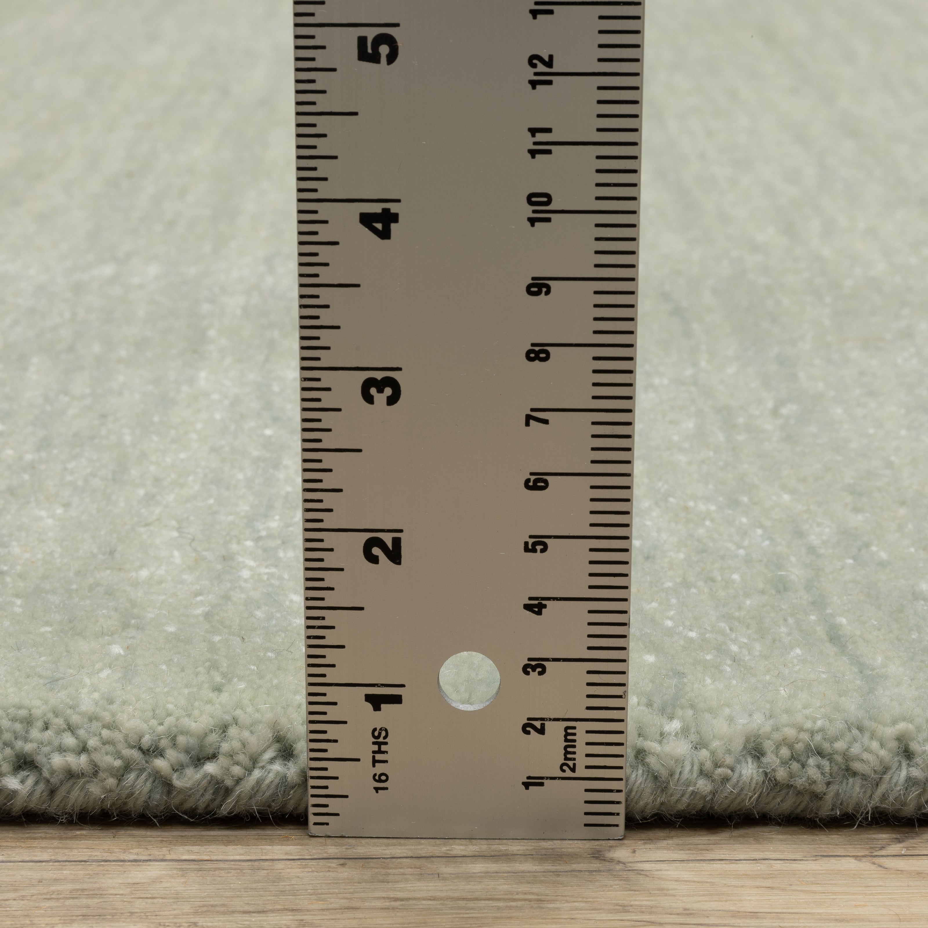 Aniston II 27115 Silver Area Rug, silver solid wool area rug with heathered texture and plush hand-tufted surface.