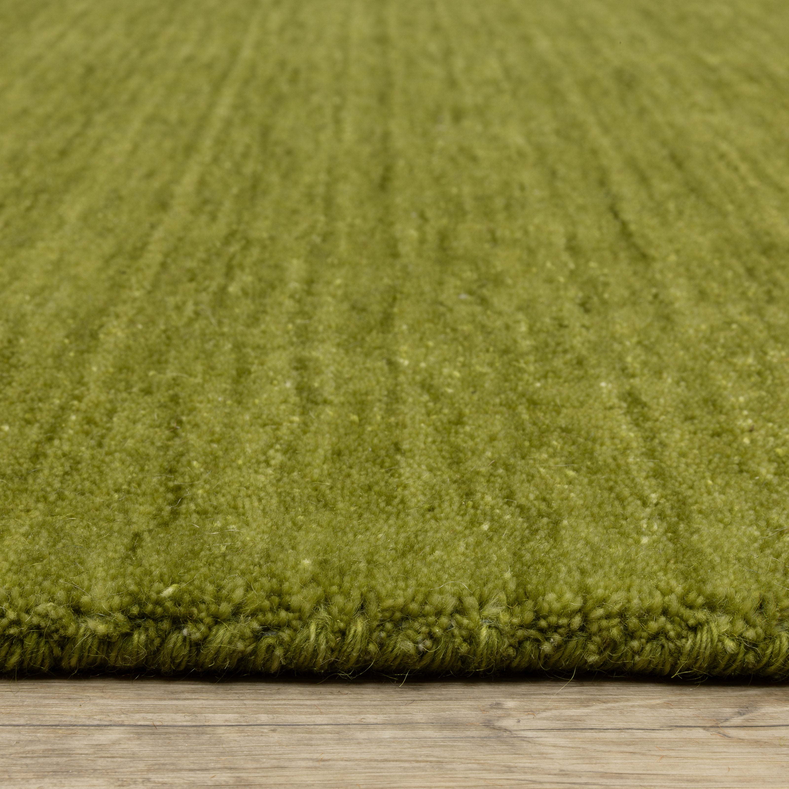 Aniston II 27116 Olive Green Area Rug, olive green solid wool area rug with heathered texture and plush hand-tufted surface.
