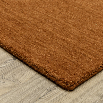 Aniston II 27118 Rust Area Rug, rust solid wool area rug with heathered texture and plush hand-tufted surface.