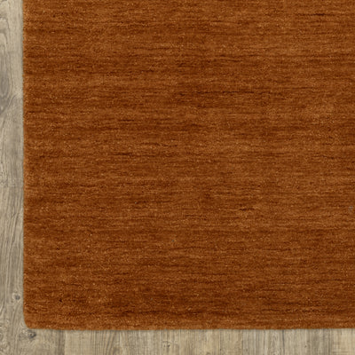 Aniston II 27118 Rust Area Rug, rust solid wool area rug with heathered texture and plush hand-tufted surface.