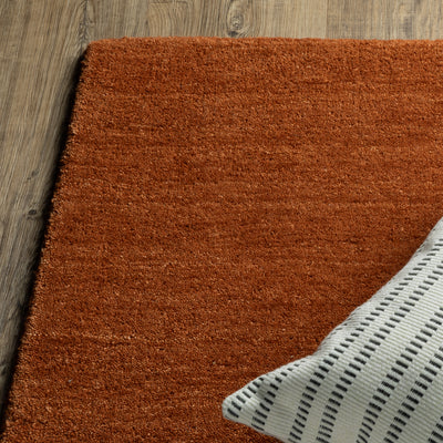 Aniston II 27118 Rust Area Rug, rust solid wool area rug with heathered texture and plush hand-tufted surface.