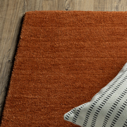 Aniston II 27118 Rust Area Rug, rust solid wool area rug with heathered texture and plush hand-tufted surface.