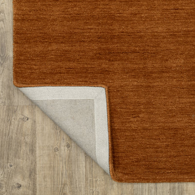 Aniston II 27118 Rust Area Rug, rust solid wool area rug with heathered texture and plush hand-tufted surface.