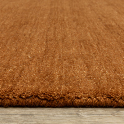 Aniston II 27118 Rust Area Rug, rust solid wool area rug with heathered texture and plush hand-tufted surface.