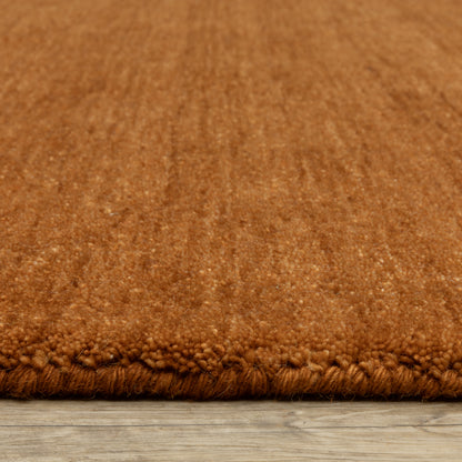 Aniston II 27118 Rust Area Rug, rust solid wool area rug with heathered texture and plush hand-tufted surface.