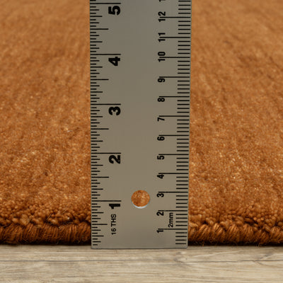 Aniston II 27118 Rust Area Rug, rust solid wool area rug with heathered texture and plush hand-tufted surface.