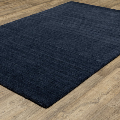 Aniston II 27119 Navy Area Rug, navy solid wool area rug with heathered texture and plush hand-tufted surface.