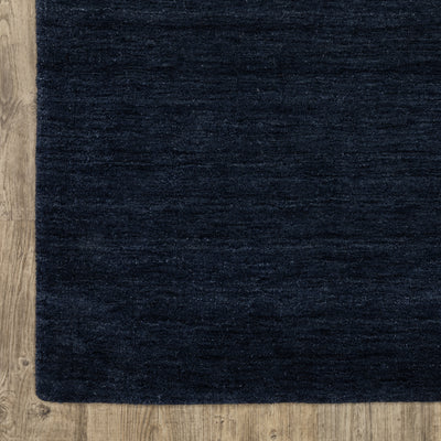 Aniston II 27119 Navy Area Rug, navy solid wool area rug with heathered texture and plush hand-tufted surface.