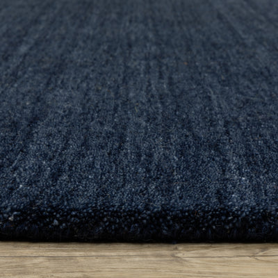 Aniston II 27119 Navy Area Rug, navy solid wool area rug with heathered texture and plush hand-tufted surface.