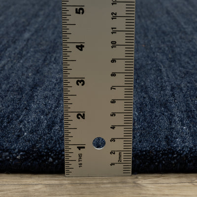 Aniston II 27119 Navy Area Rug, navy solid wool area rug with heathered texture and plush hand-tufted surface.