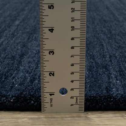 Aniston II 27119 Navy Area Rug, navy solid wool area rug with heathered texture and plush hand-tufted surface.