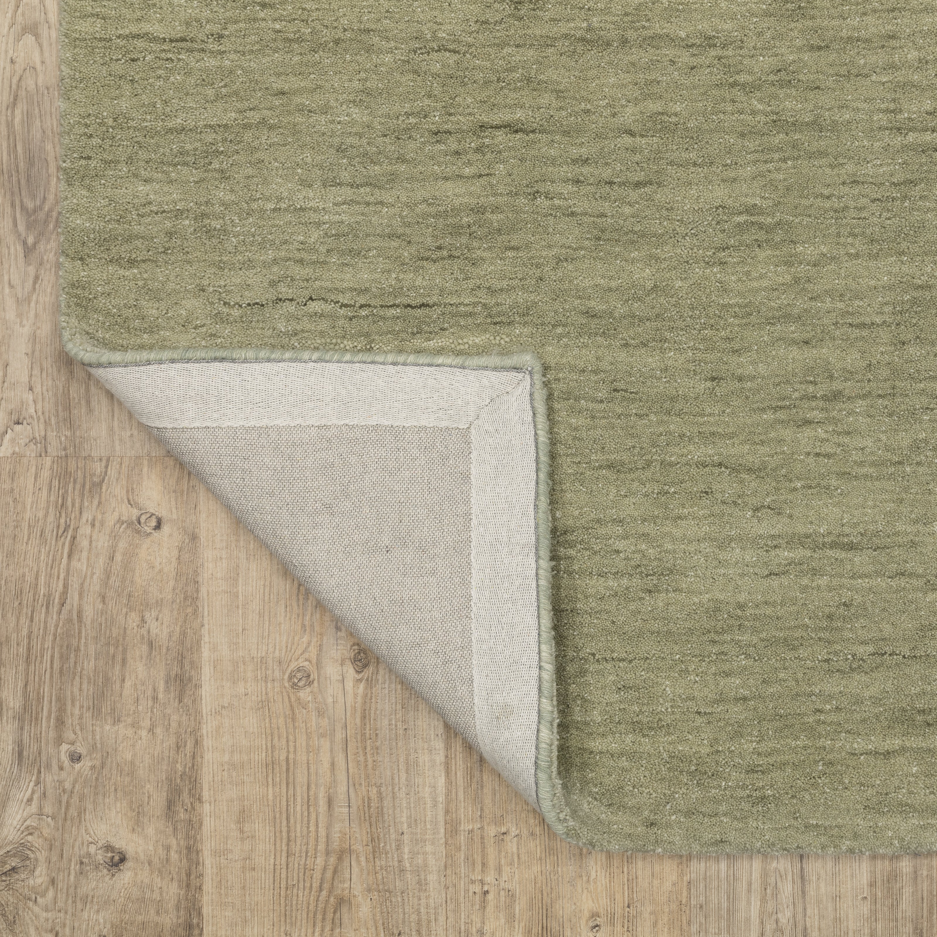 Aniston II 27120 Sage Green Area Rug, sage green solid wool area rug with heathered texture and plush hand-tufted surface.