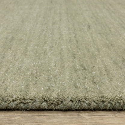 Aniston II 27120 Sage Green Area Rug, sage green solid wool area rug with heathered texture and plush hand-tufted surface.