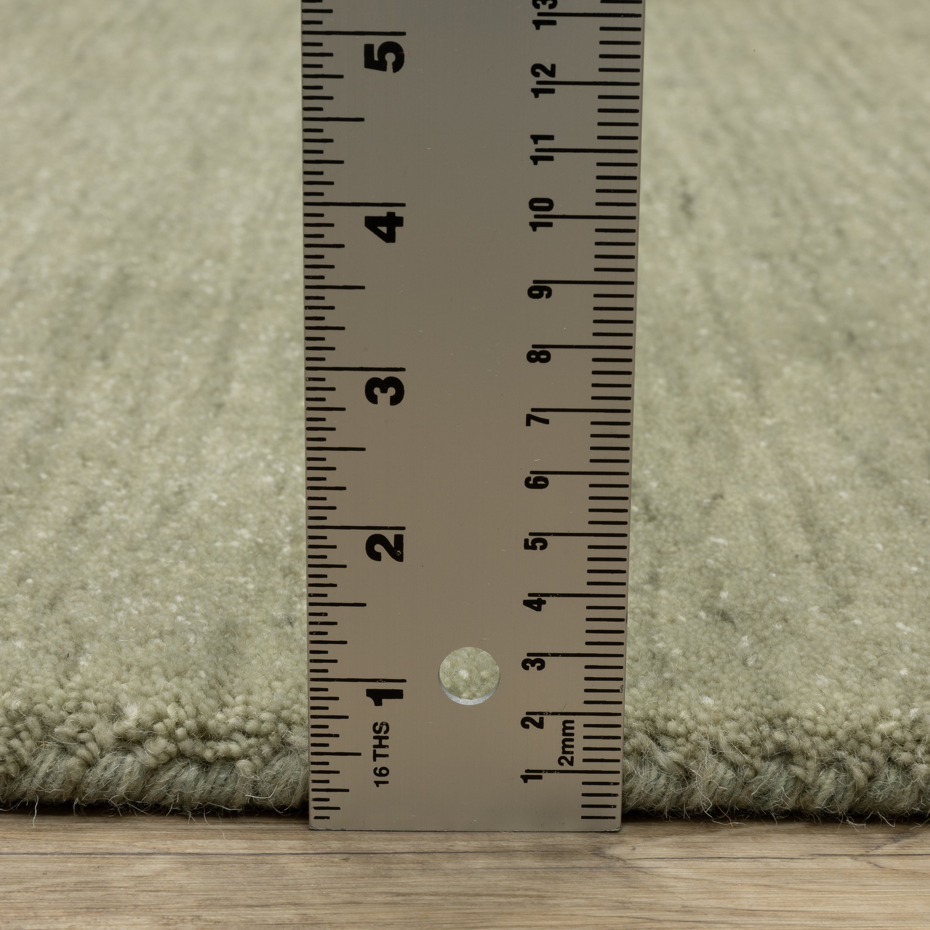 Aniston II 27120 Sage Green Area Rug, sage green solid wool area rug with heathered texture and plush hand-tufted surface.