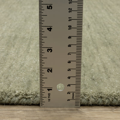 Aniston II 27120 Sage Green Area Rug, sage green solid wool area rug with heathered texture and plush hand-tufted surface.