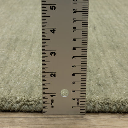Aniston II 27120 Sage Green Area Rug, sage green solid wool area rug with heathered texture and plush hand-tufted surface.