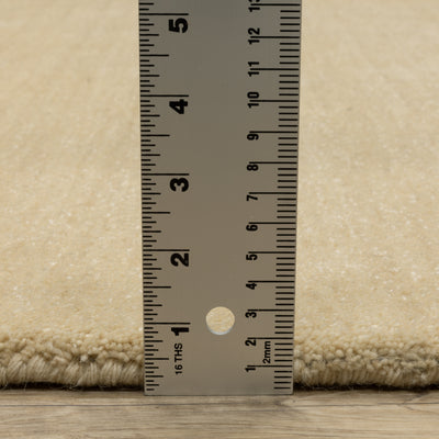 Aniston II 27122 Beige Area Rug, beige solid wool area rug with heathered texture and plush hand-tufted surface.