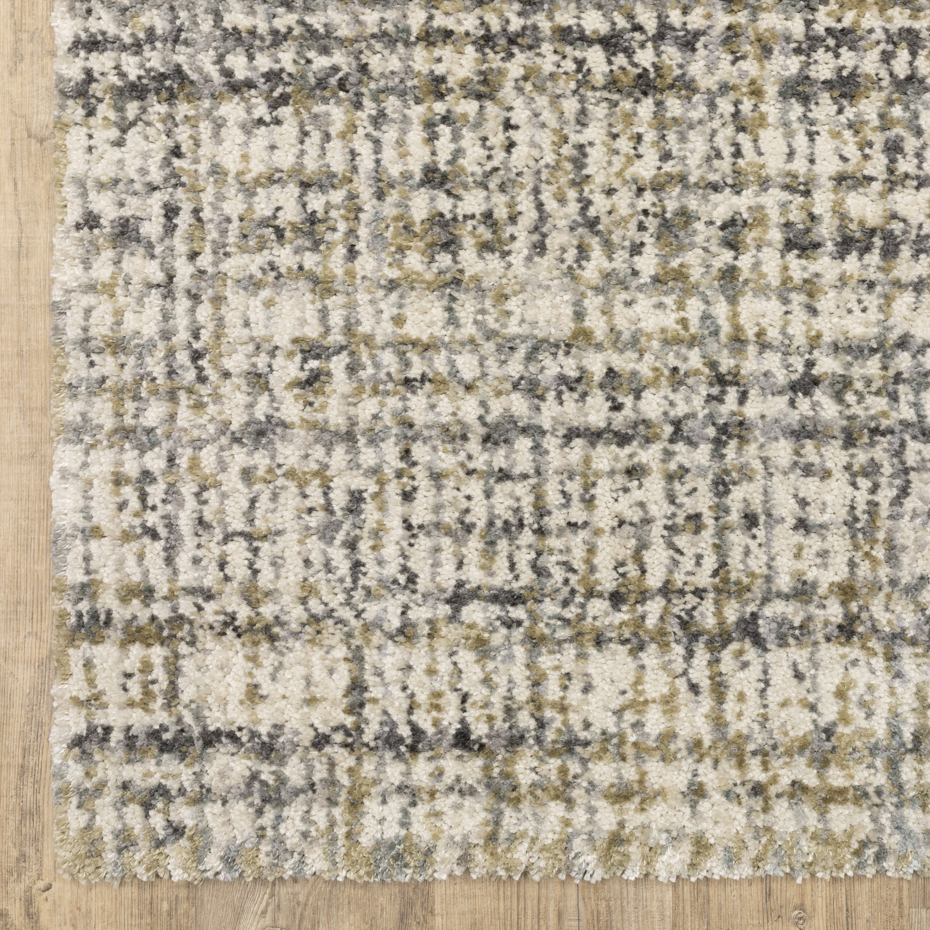 Oriental Weavers Aspen 2877B plush shag rug featuring abstract pattern in ivory/ gold tones