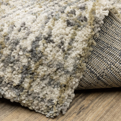 Oriental Weavers Aspen 2877B plush shag rug featuring abstract pattern in ivory/ gold tones